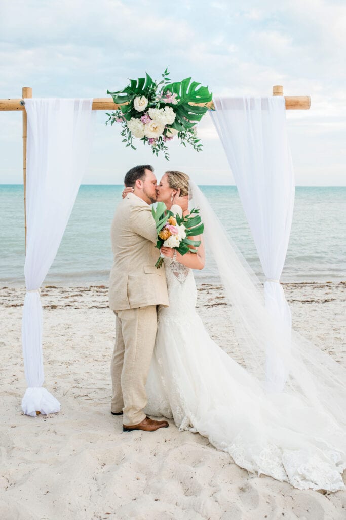 Kiss at the Alter of a beach wedding